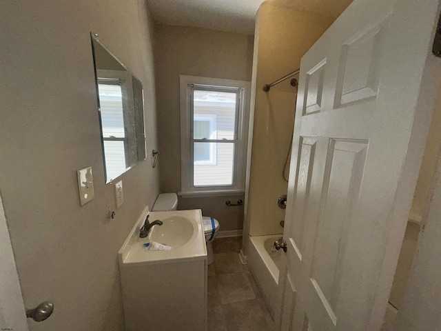 full bathroom featuring tile patterned floors, vanity, shower / bath combination, and toilet