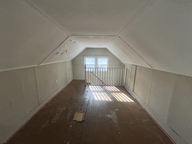 bonus room featuring hardwood / wood-style floors and vaulted ceiling