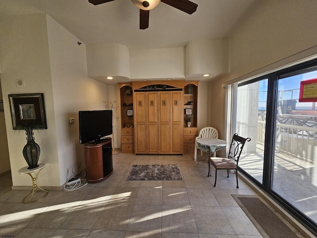 corridor featuring a high ceiling and light tile patterned flooring