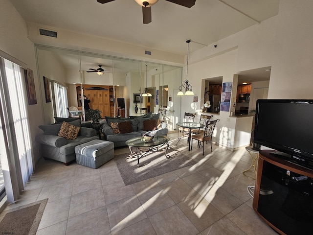 tiled living room featuring ceiling fan