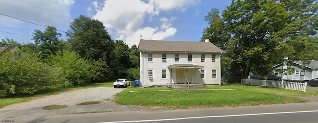 colonial inspired home with a front yard