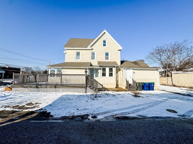 view of front of property with a wooden deck