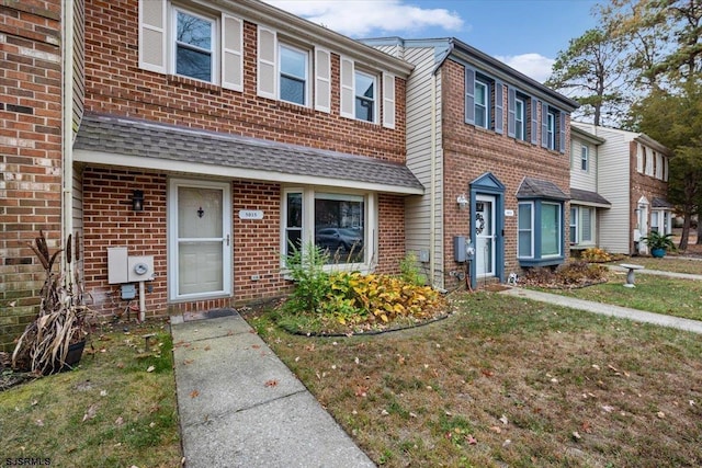 view of property with a front lawn