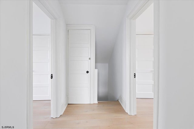 interior space with lofted ceiling and light wood finished floors