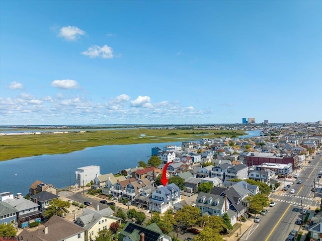 aerial view with a water view and a residential view