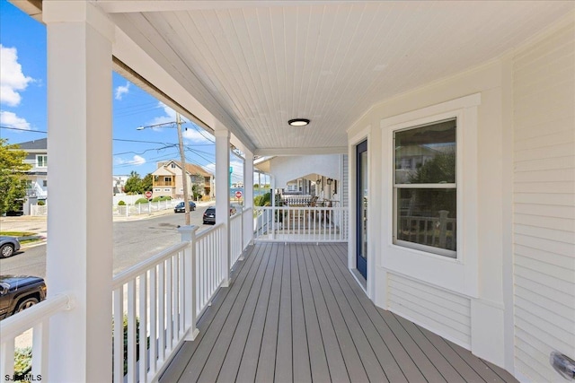 wooden terrace with a porch