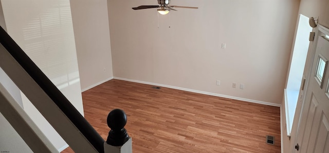 spare room featuring light wood-type flooring and ceiling fan