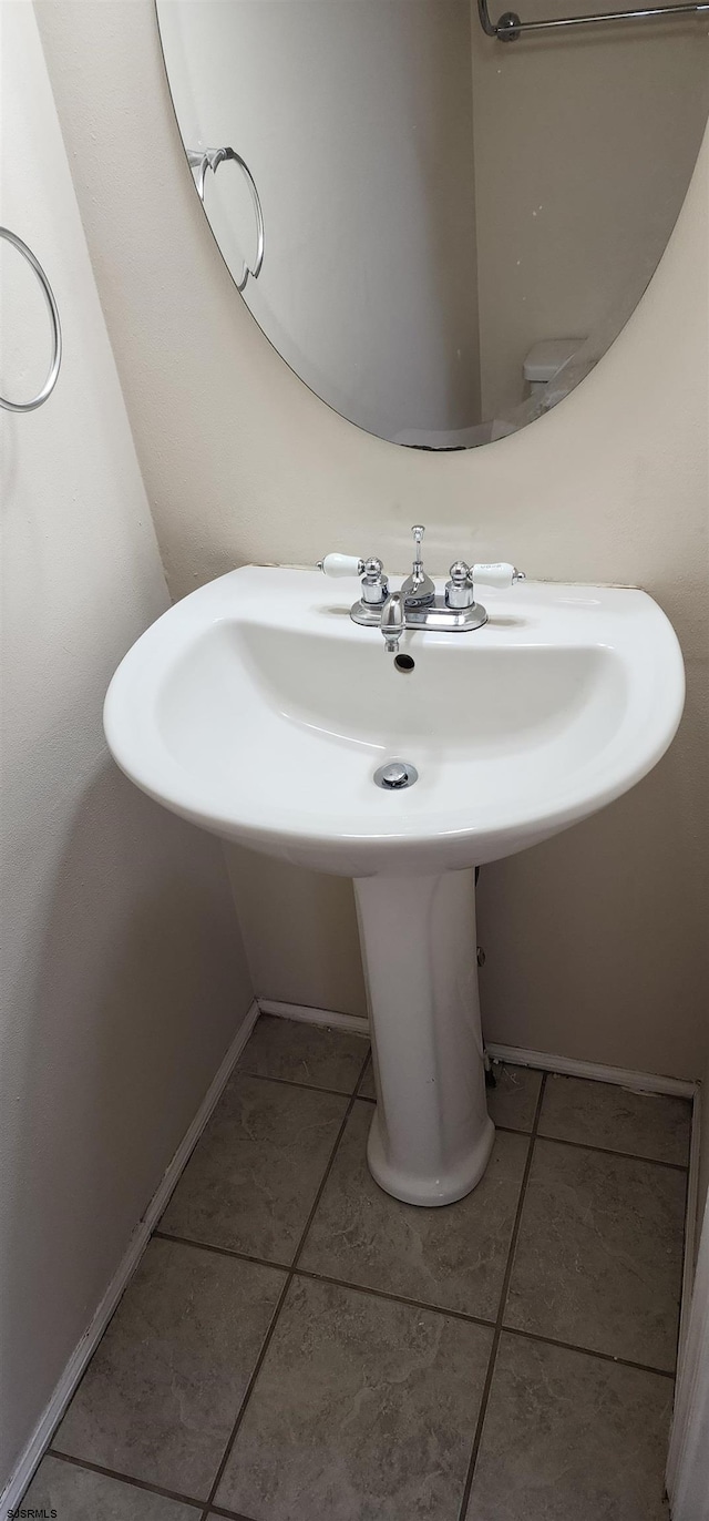 bathroom with tile patterned floors