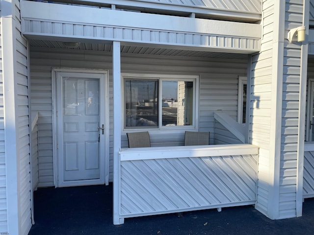 doorway to property featuring a porch