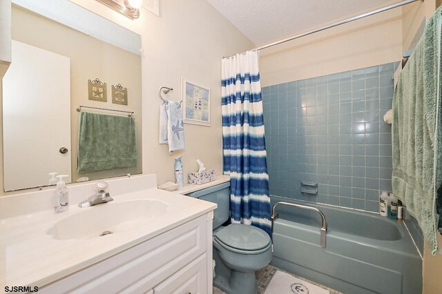 bathroom with shower / bath combo, vanity, toilet, and a textured ceiling