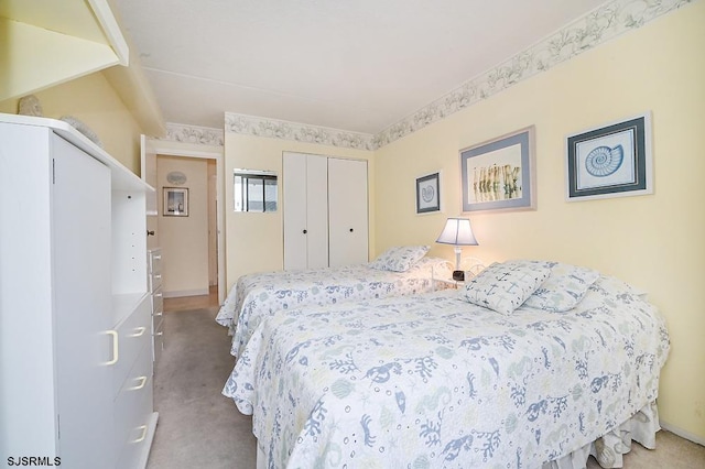 carpeted bedroom with a closet