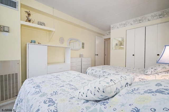 bedroom with visible vents and a closet