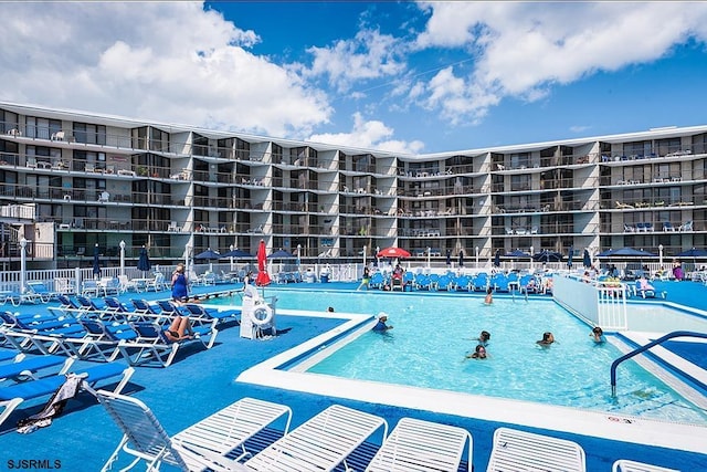 community pool featuring fence