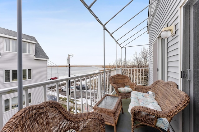 balcony featuring a water view