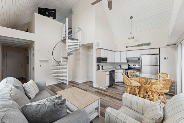 living room featuring ceiling fan, sink, high vaulted ceiling, and hardwood / wood-style flooring