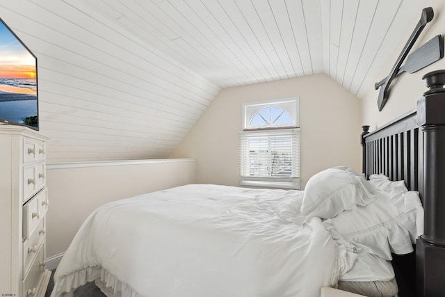 bedroom featuring wood ceiling and vaulted ceiling