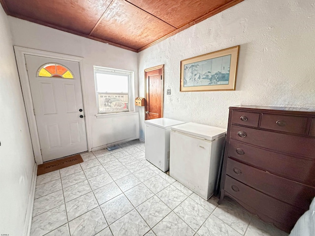 laundry area with washer and clothes dryer and wooden ceiling