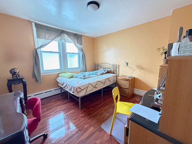 bedroom featuring dark hardwood / wood-style flooring and baseboard heating