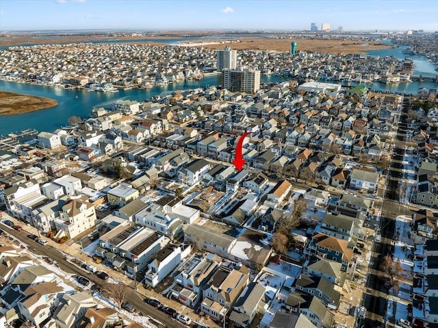 birds eye view of property featuring a water view