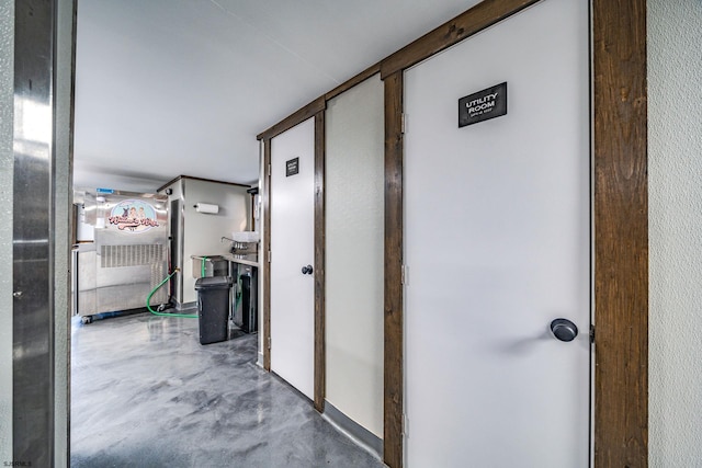 hallway featuring concrete flooring