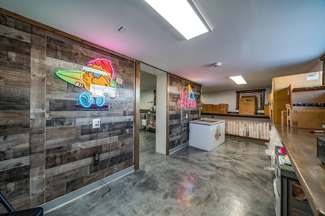 kitchen featuring wooden walls