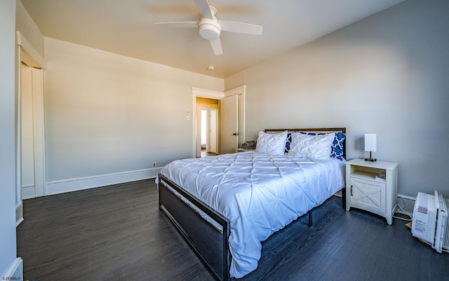 bedroom with dark wood-type flooring and ceiling fan