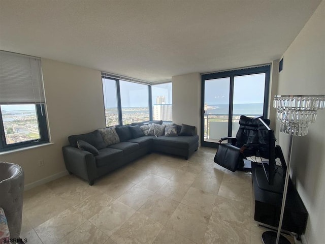 living room with plenty of natural light and a water view