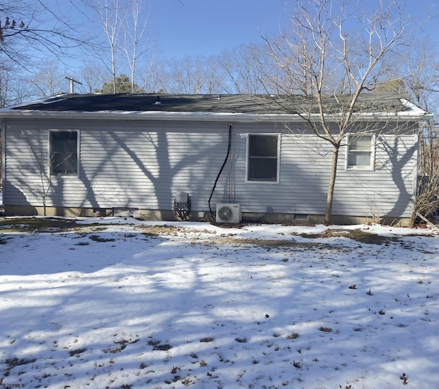 view of snow covered exterior with ac unit