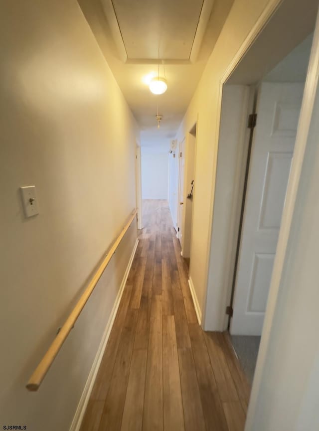 corridor with dark wood-type flooring