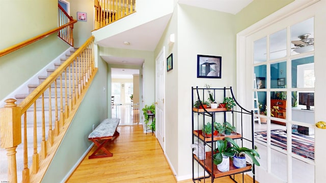 corridor with light hardwood / wood-style flooring