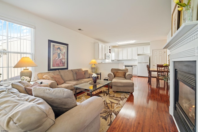 living room with dark wood-type flooring