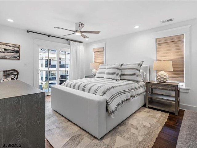 bedroom featuring access to outside, ceiling fan, and hardwood / wood-style flooring