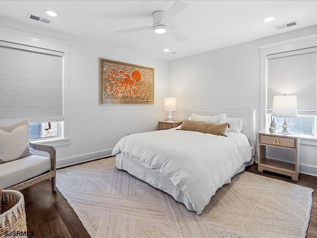 bedroom with ceiling fan and hardwood / wood-style flooring