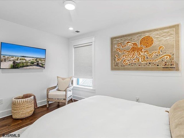 bedroom with hardwood / wood-style flooring