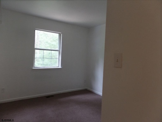 unfurnished room featuring carpet floors