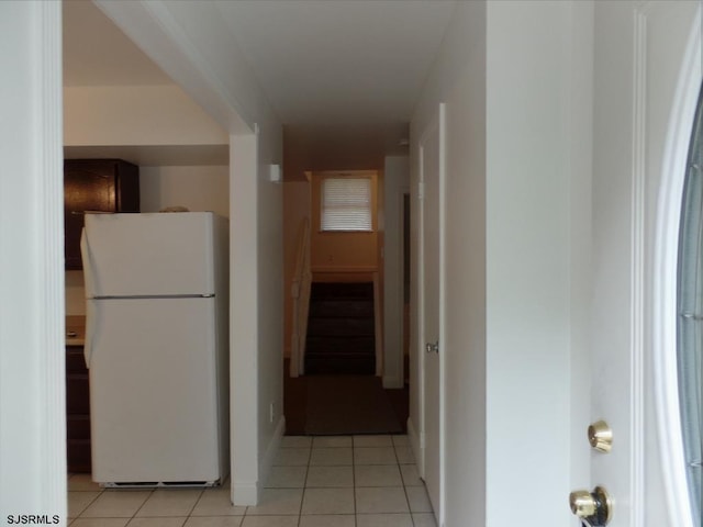 hallway featuring light tile patterned flooring