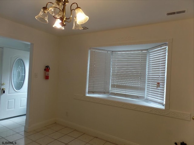 interior space featuring plenty of natural light and a chandelier