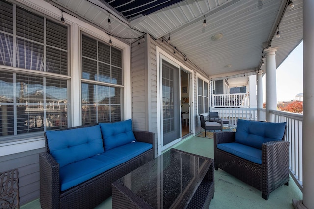 balcony featuring outdoor lounge area and covered porch