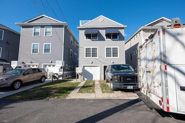 front of property with a garage