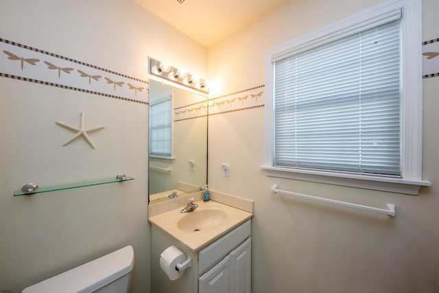 bathroom with vanity and toilet