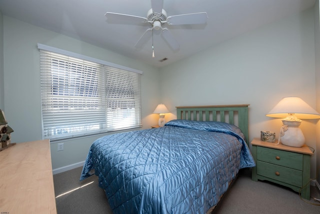 bedroom featuring ceiling fan and carpet