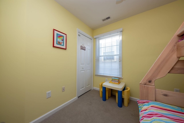 carpeted bedroom featuring a closet