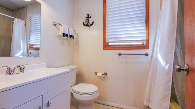 bathroom featuring tile patterned flooring, vanity, a shower with shower curtain, and toilet