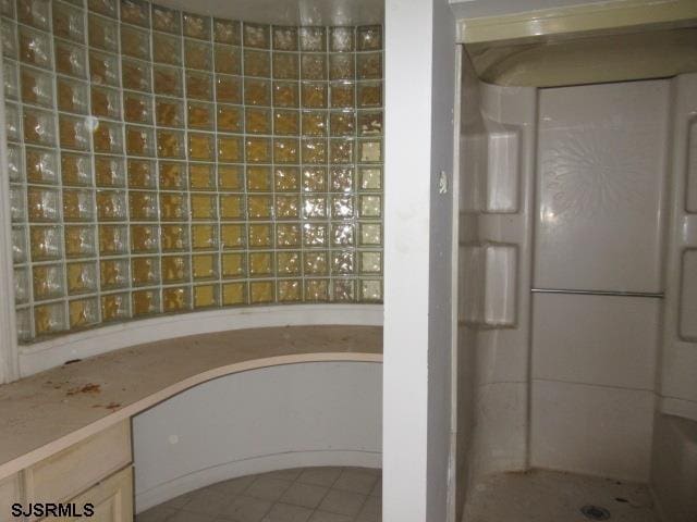 bathroom with tile patterned flooring