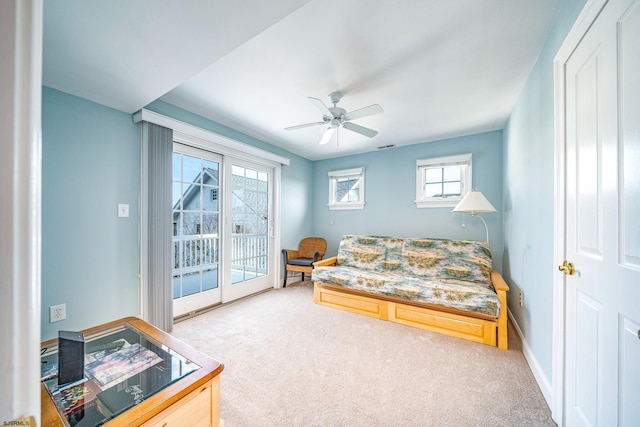 living room with carpet floors and ceiling fan