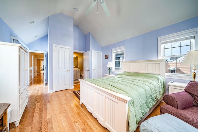 bedroom with lofted ceiling, ceiling fan, and light hardwood / wood-style flooring