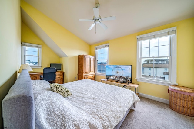 bedroom with lofted ceiling, ceiling fan, and light colored carpet