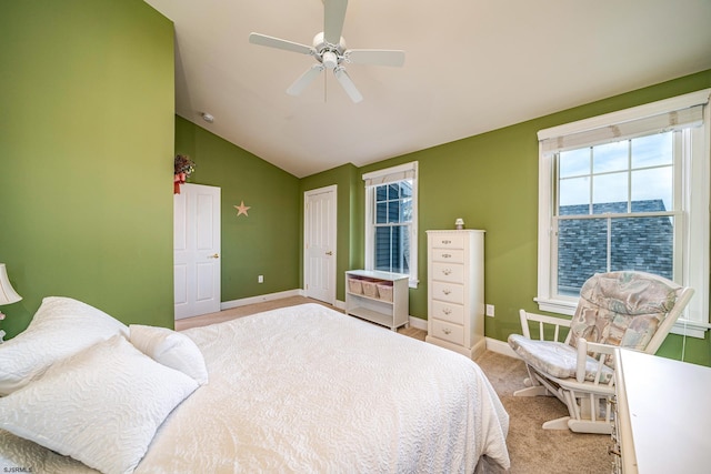 carpeted bedroom featuring ceiling fan and lofted ceiling