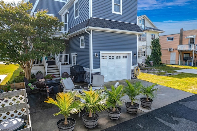 view of side of property with a garage