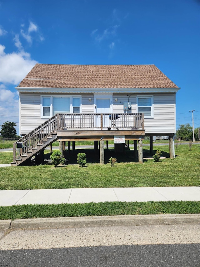 back of house with a yard and a wooden deck